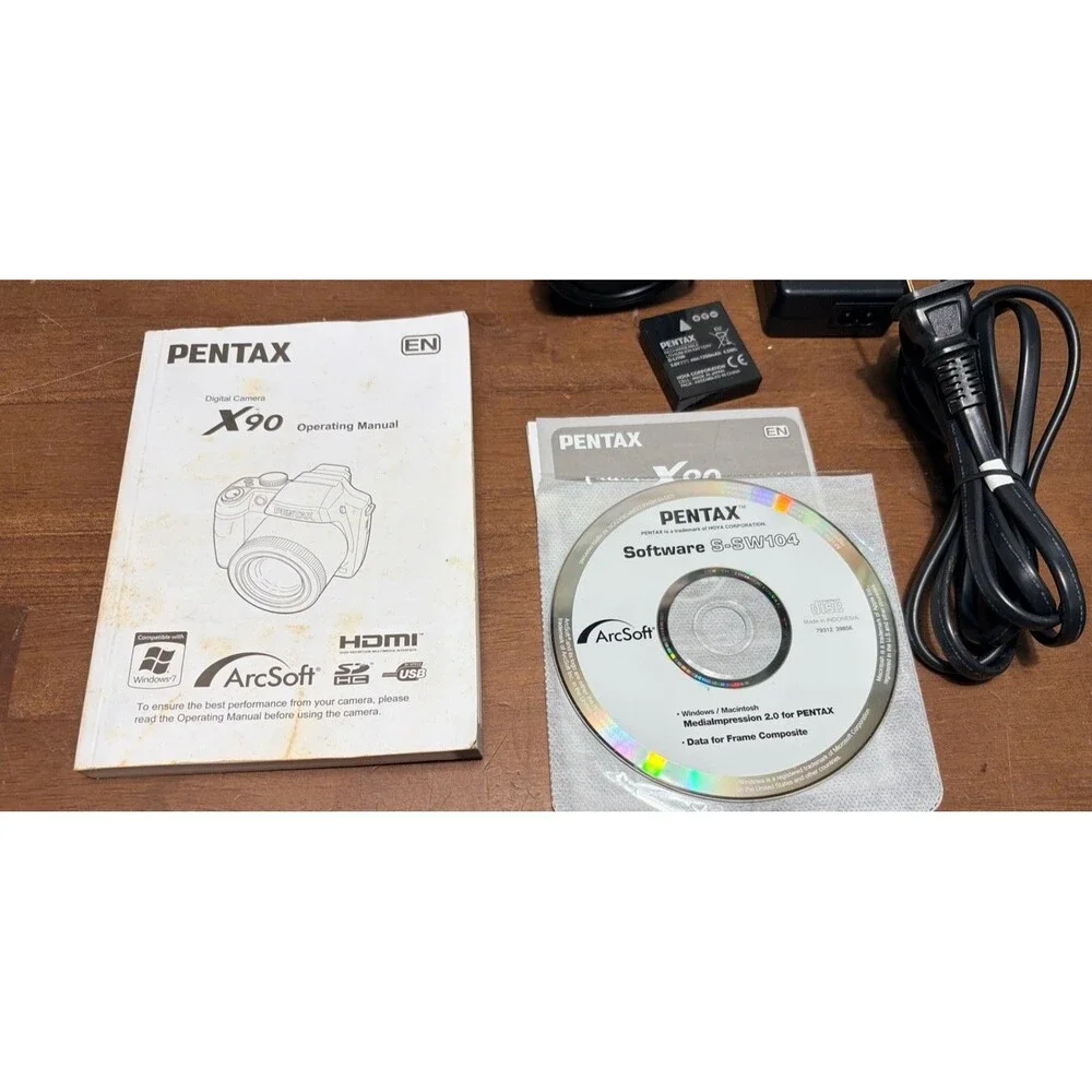Pentax X90 12.1MP Digital Bridging Camera w/manual, Battery, Charger & Strap
